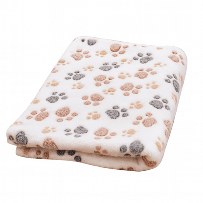 Folded blanket with paw print pattern on a white background